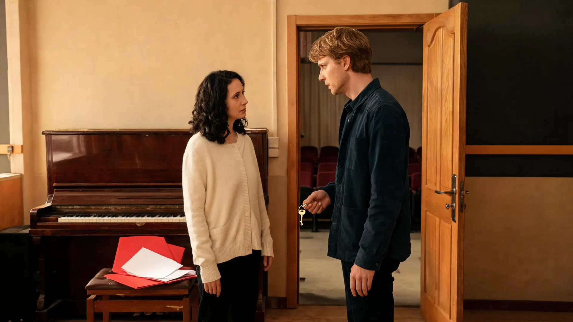 APOB-generated fictional rehearsal room with two adults, a red folder on a piano stool and a visible key near the doorway.